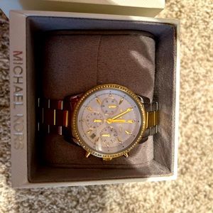 Great condition Michael kors woman gold and silver watch with crystals.